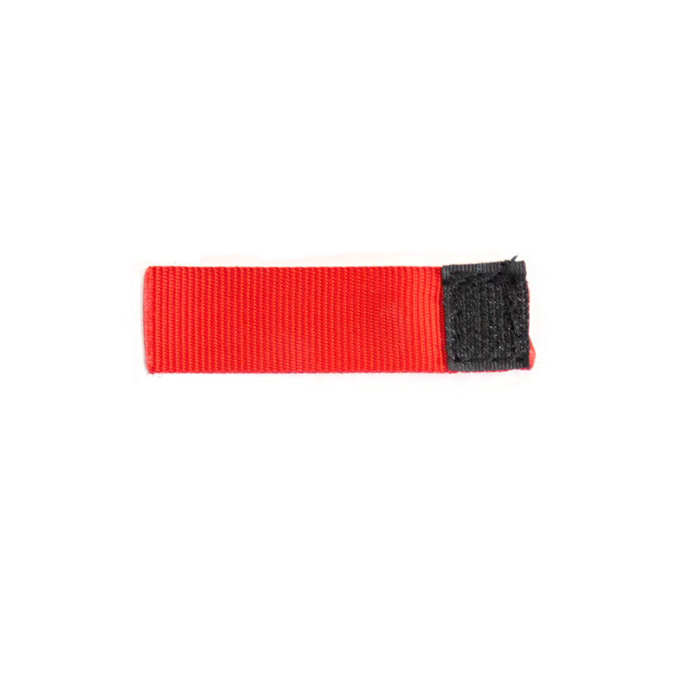 Red score tag has black Velcro on the back of it.