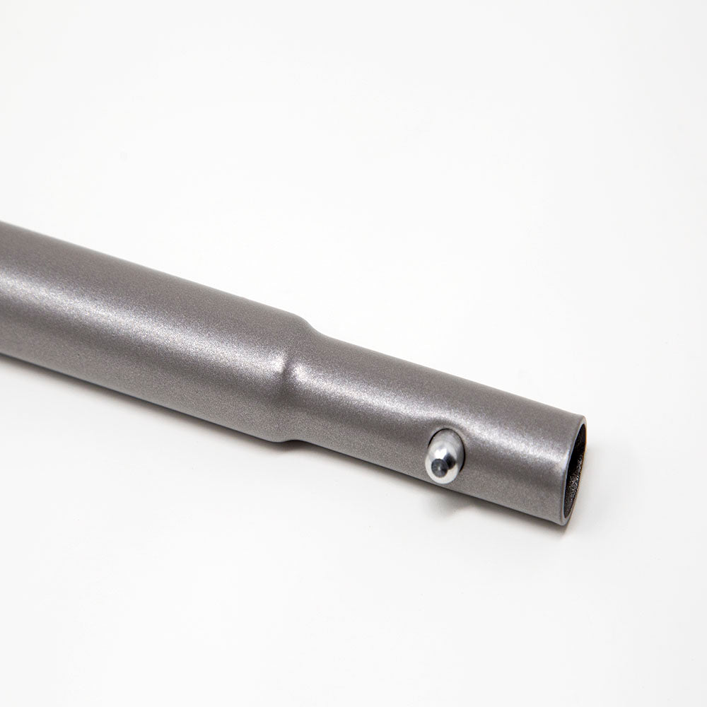 Close-up view of the button end of the steel tube.