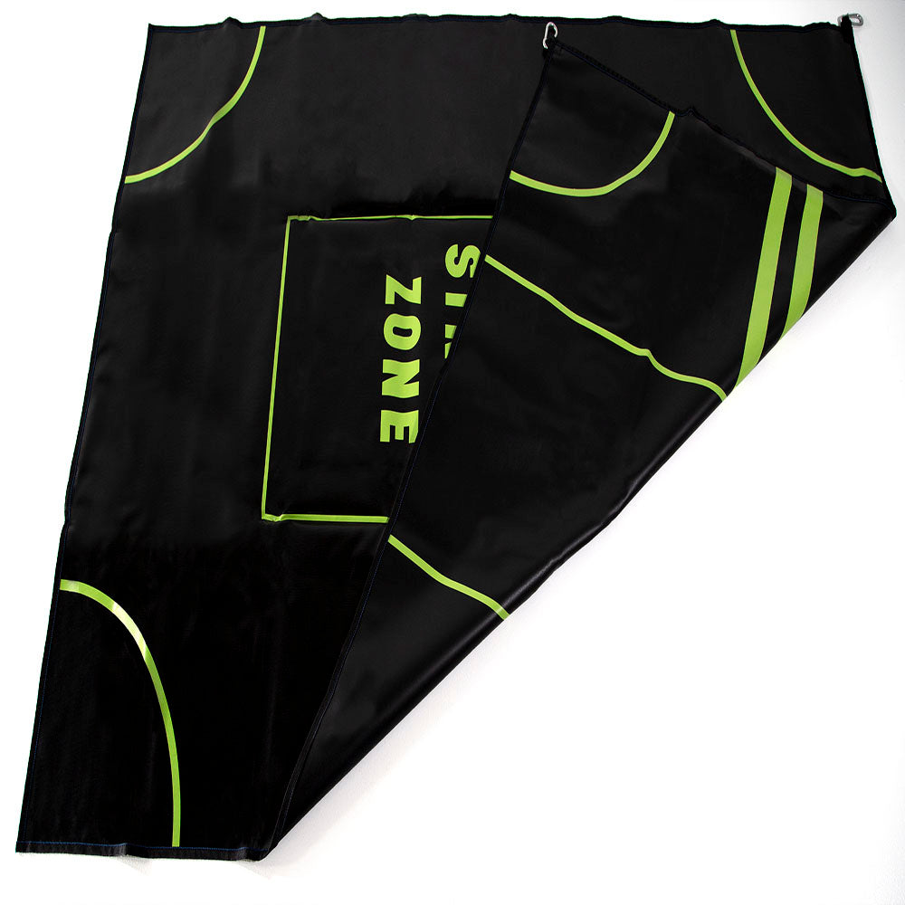 The target mat is folded so the lime green target design can be seen on both sides.