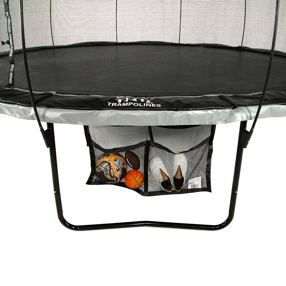 The Two Pocket Accessory Storage Bag is holding three balls in one pocket and a pair of shoes in the other.
