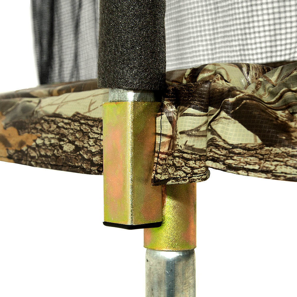 The gold-colored T-socket sits underneath the camouflage-patterned spring pad.