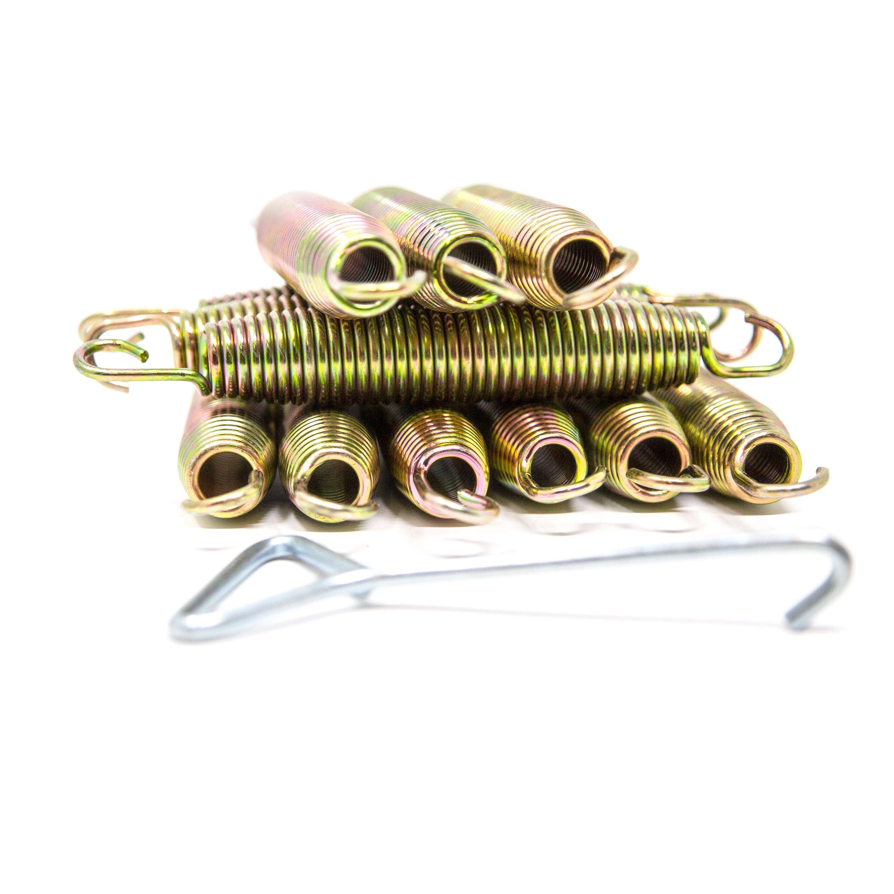 Gold 7-inch springs are stacked in a pile with a silver spring puller next to them.