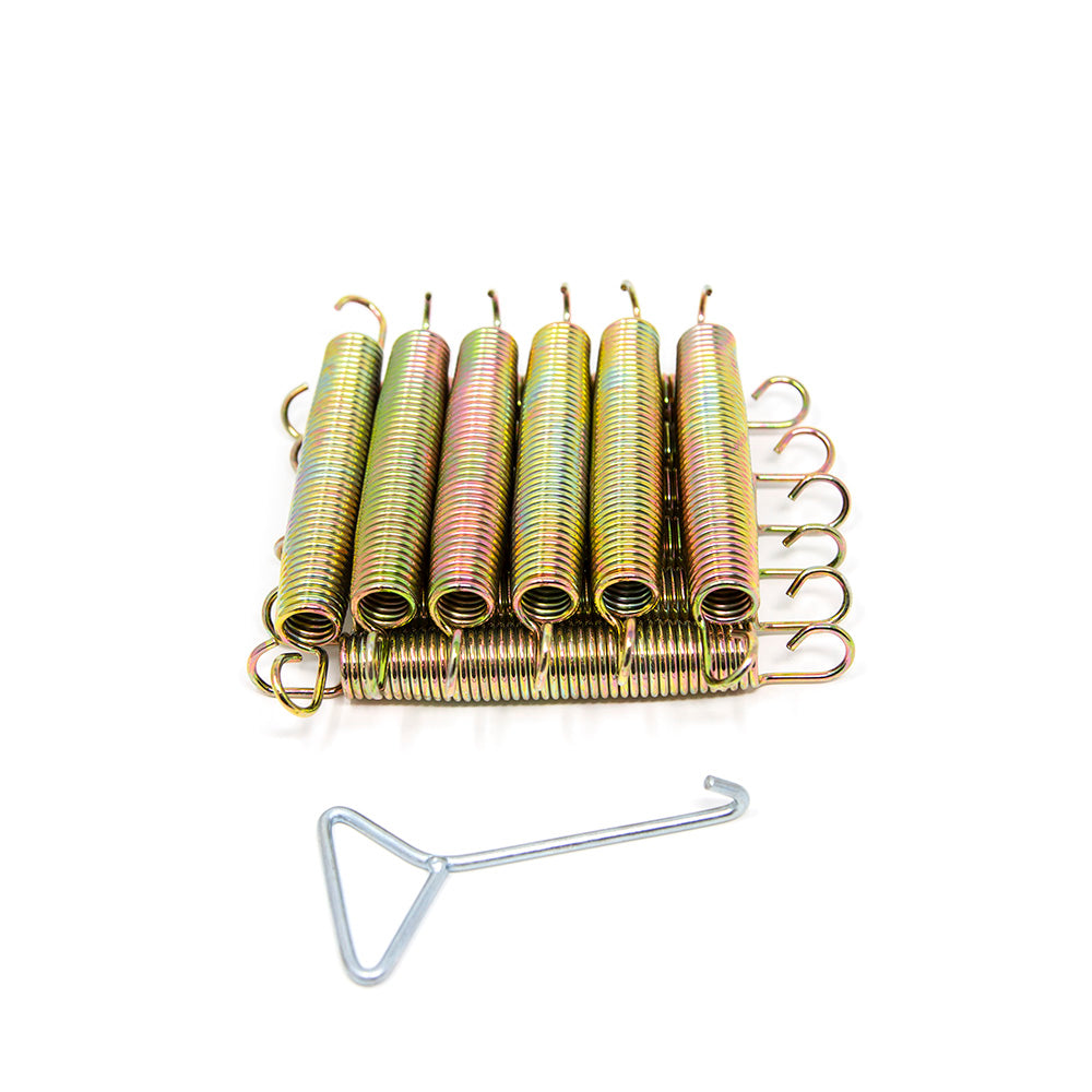 12 springs stacked on top of each other with a spring puller sitting in front of them.