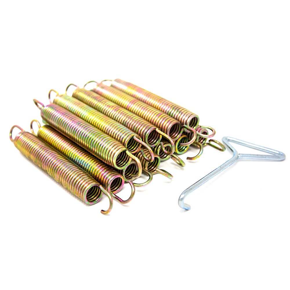 Shiny gold-colored springs in two layers with a spring puller next to the pile.