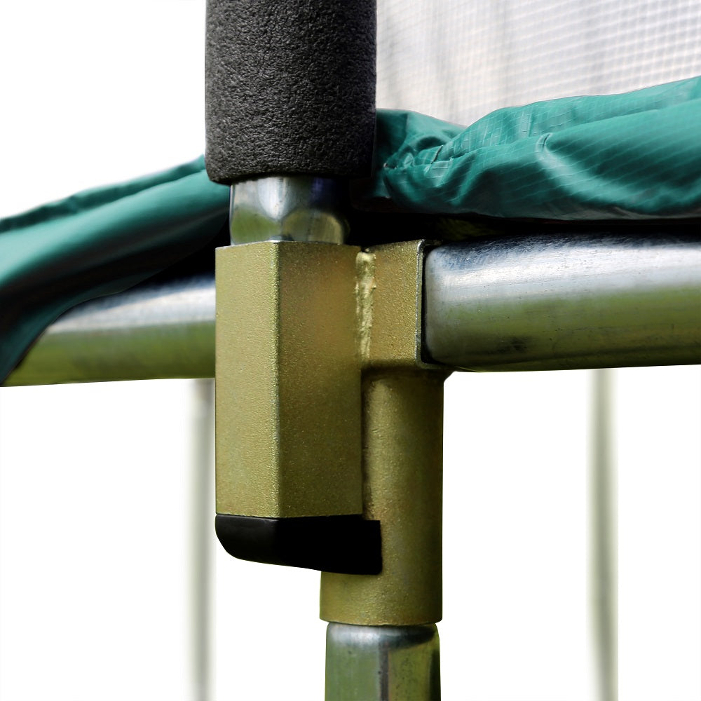 Green spring pad sits on top of the trampoline frame and the T-socket. 