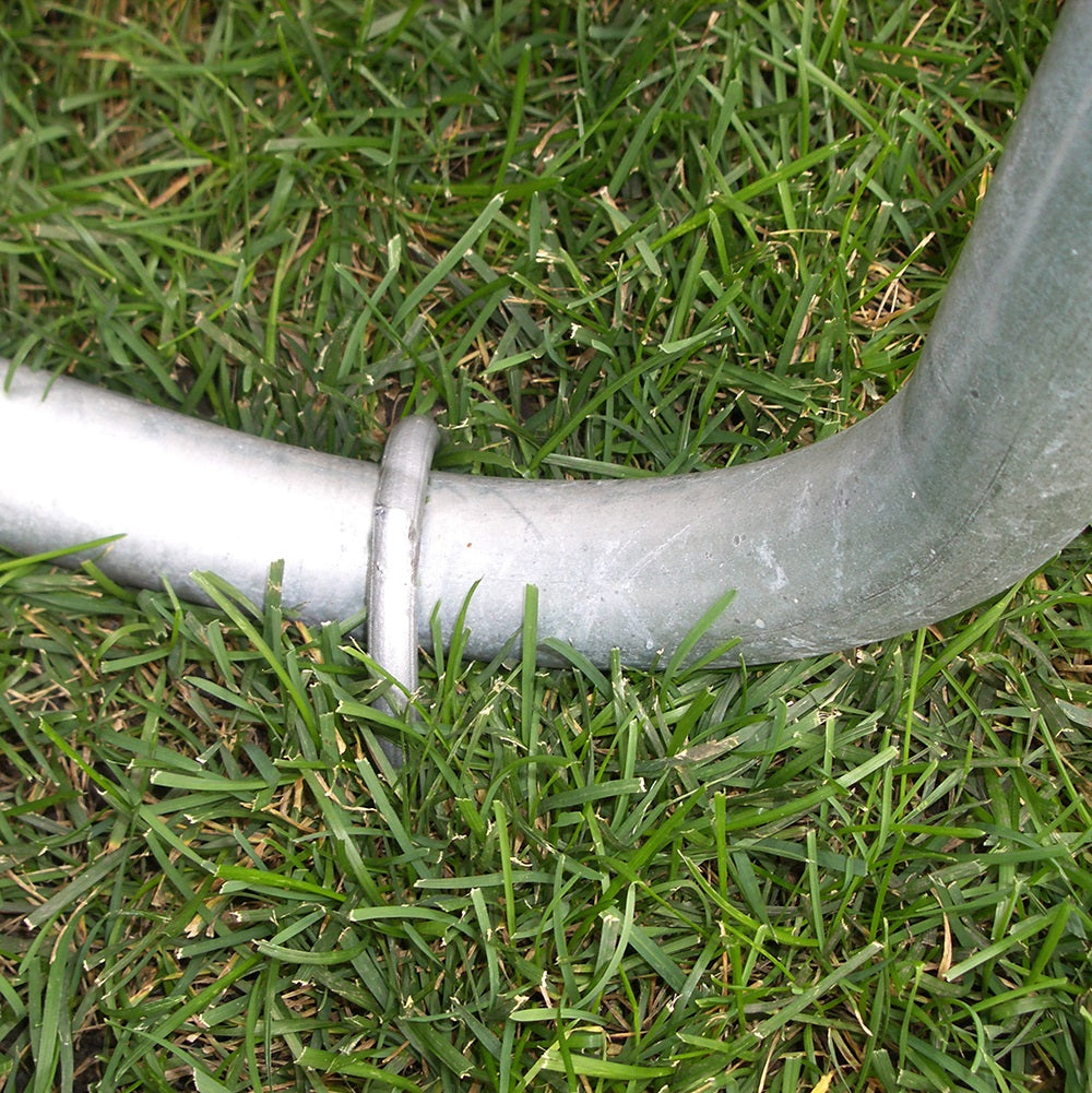 Wind stake secured around trampoline leg.