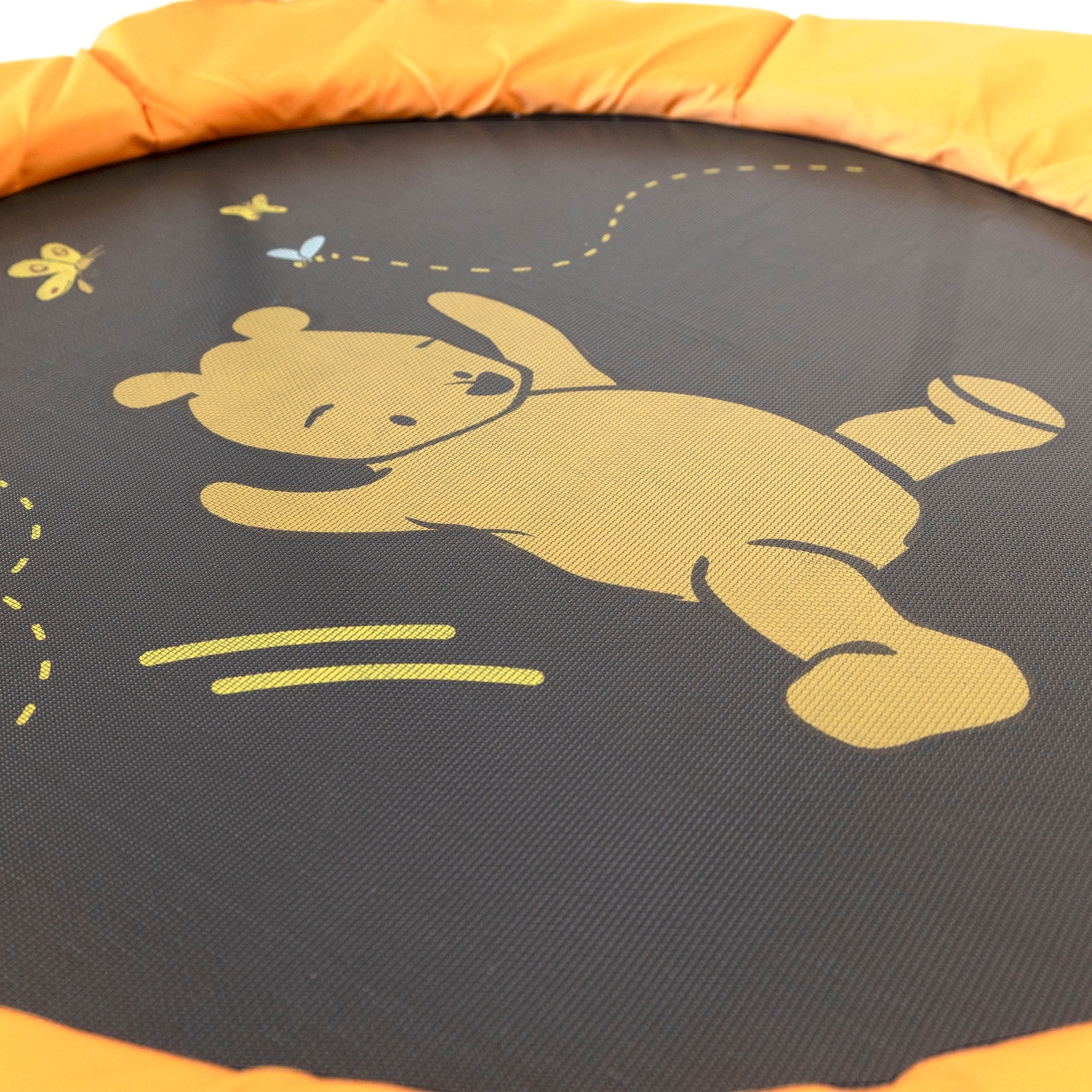 The yellow Winnie the Pooh character design is printed on the black jump mat with a yellow frame pad surrounding it. 