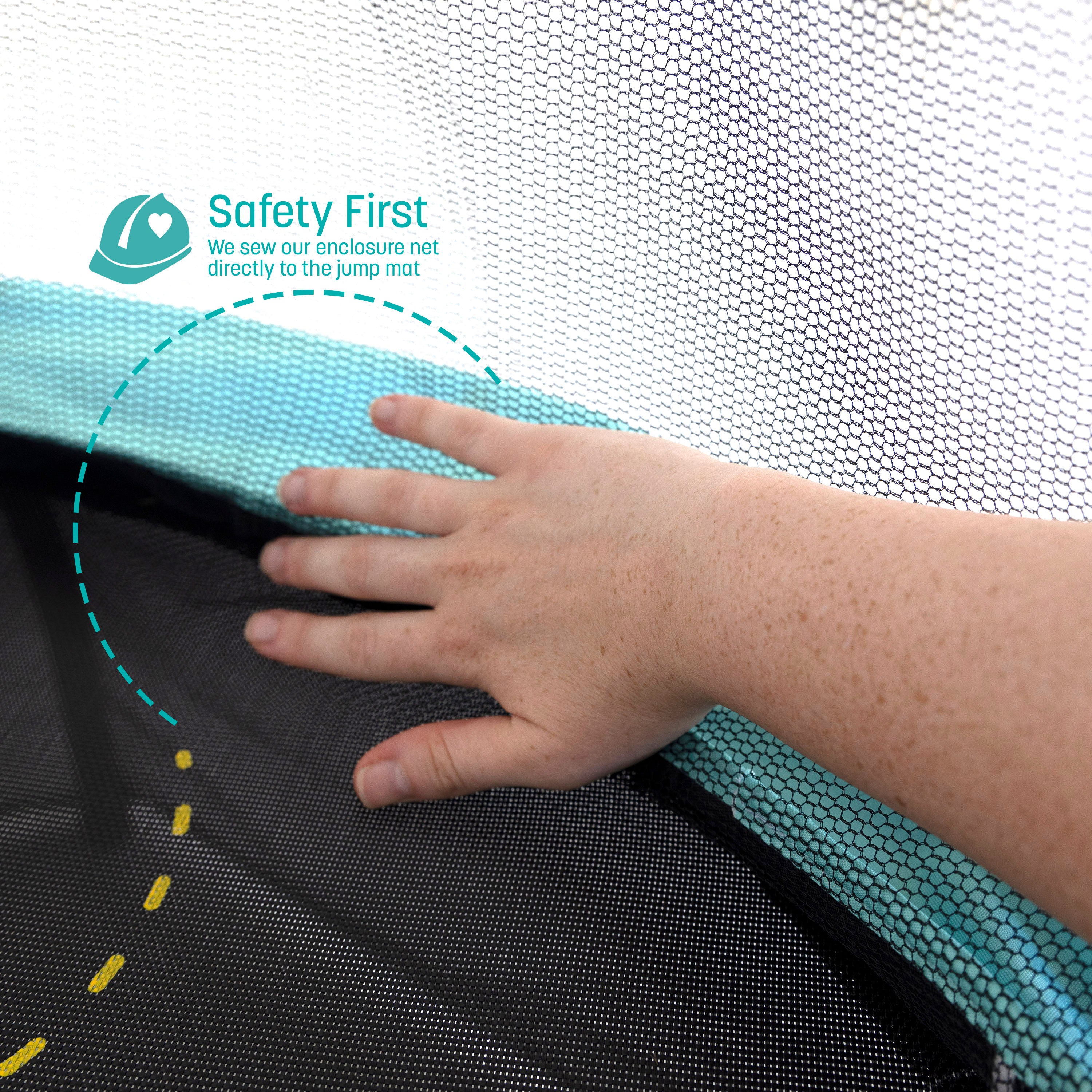 A hand pushes back the enclosure net. A teal callout feature states, “Safety First: We sew our enclosure net directly to the jump mat”.