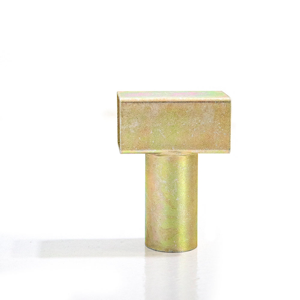Gold-colored T-joint. 