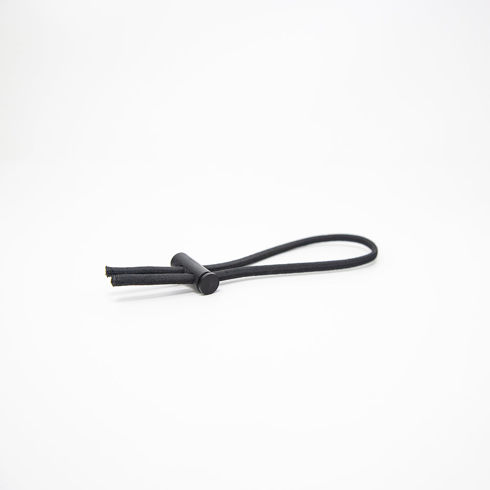 Black plastic cinch with cord. 