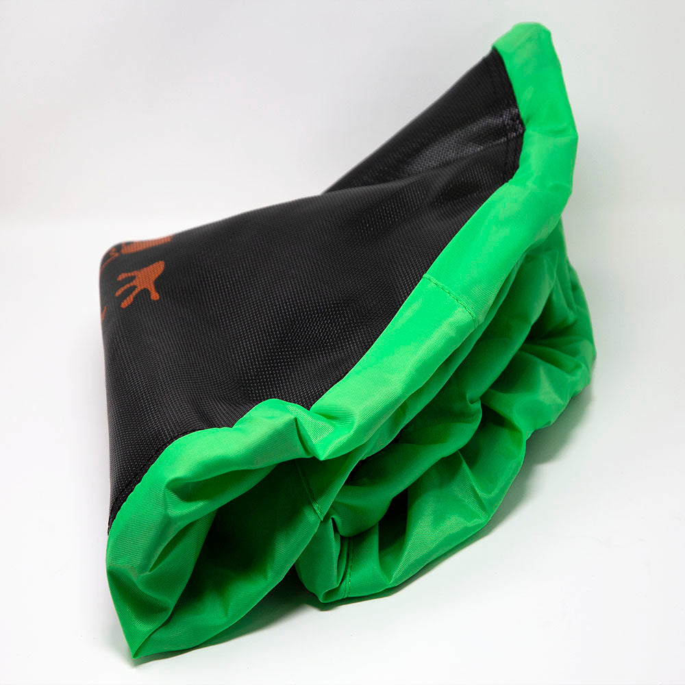 The black jump mat is trimmed with the attached green spring pad. 