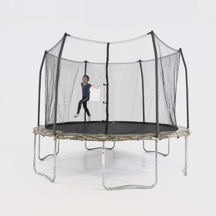 Three young children jump around on the 12-foot camo trampoline. 