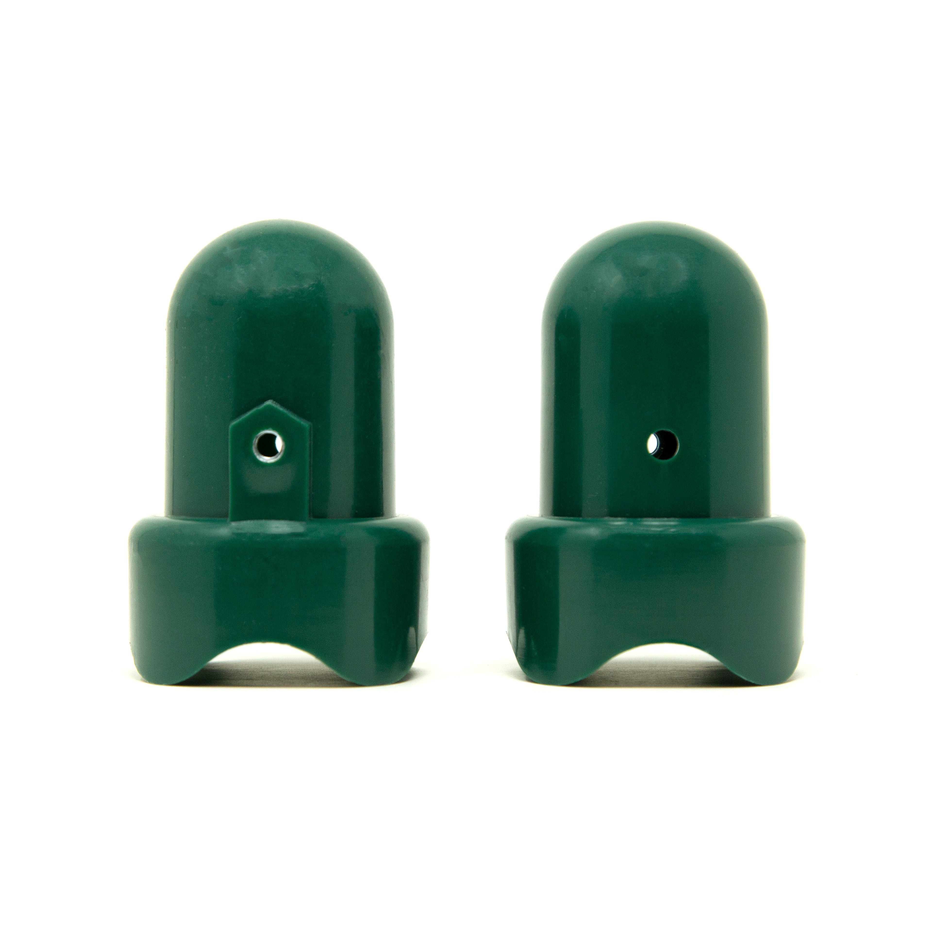 Two green pole caps facing opposite directions. 