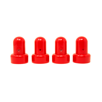 Four red pole caps sitting in a row next to each other. 