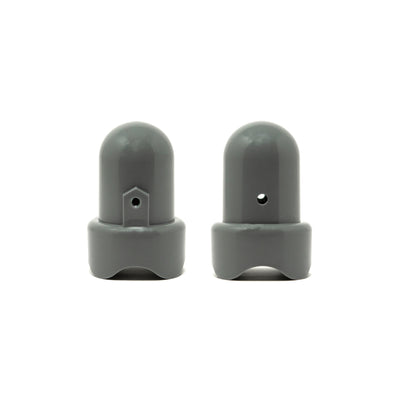 Two 1.75" gray pole caps standing upright next to each other.