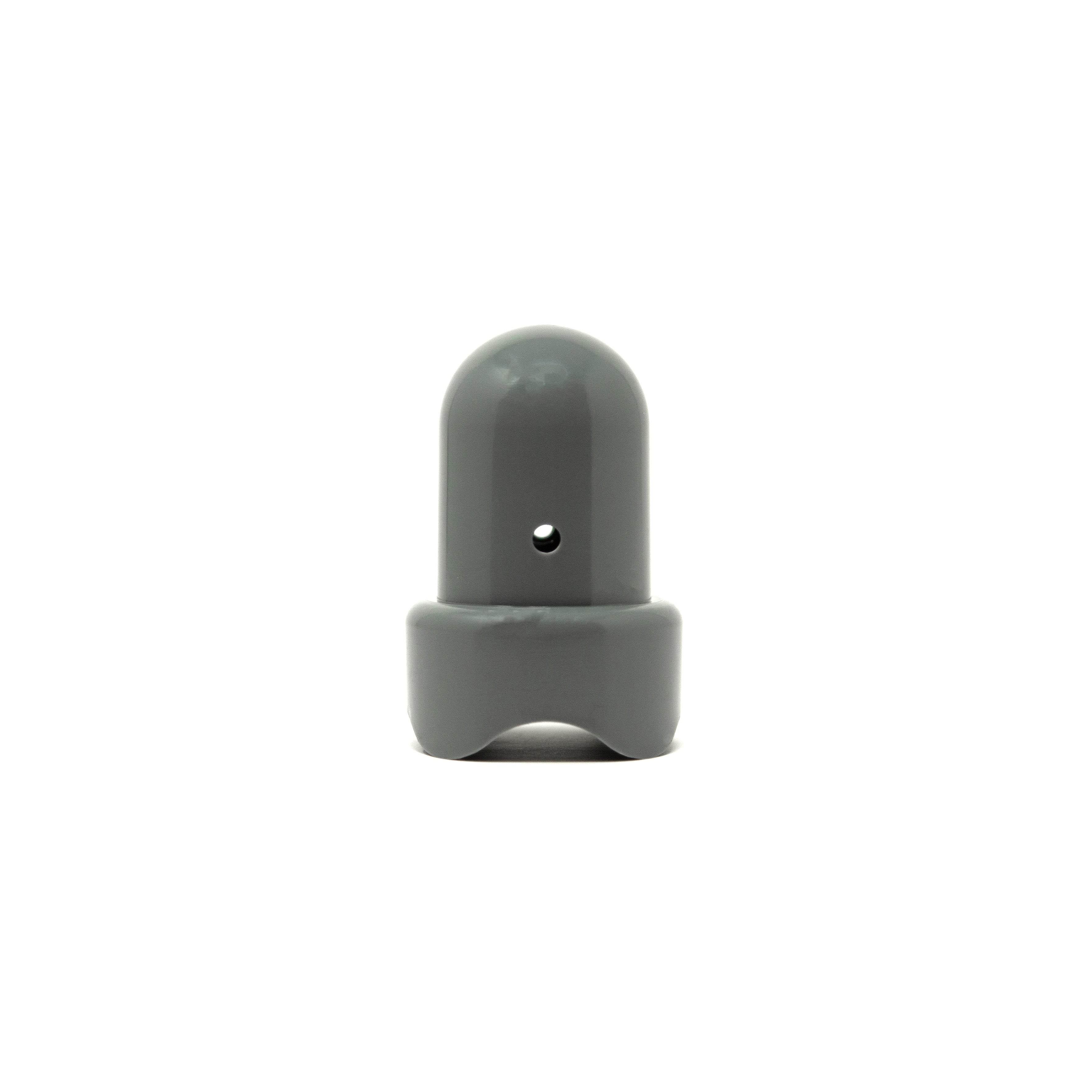Gray pole cap with the round hole facing forward.