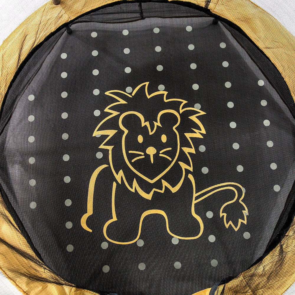 Black jump mat covered with polka-dot design and a yellowish-orange lion graphic in the center. 