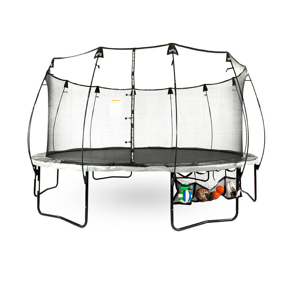 The Three Pocket Accessory Storage Bag hangs from a trampoline while storing 7 balls and a pair of shoes. 