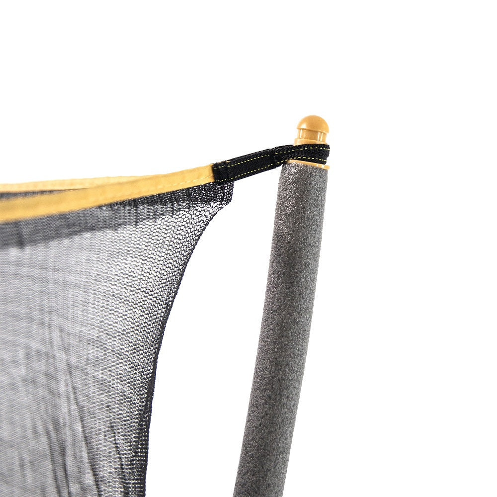 Corner of enclosure net is looped around yellow pole cap. The cap covers the top of gray foam-padded enclosure pole. 