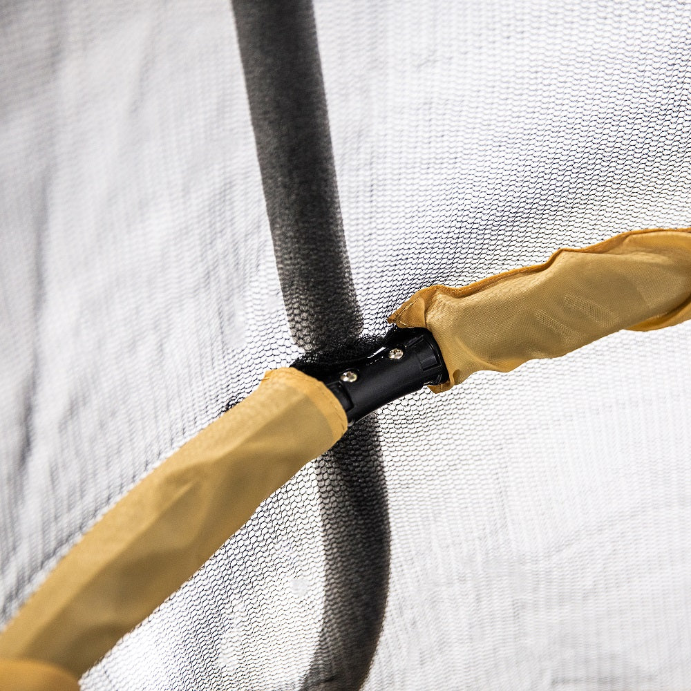 Yellow padded handlebar goes around the inside of the enclosure net. 