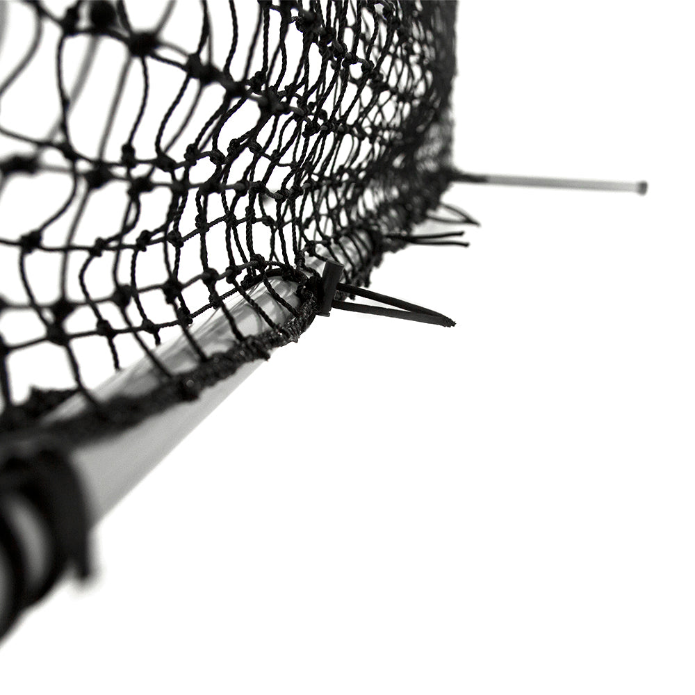 The black netting is secured to the gray frame with bungee cords. 