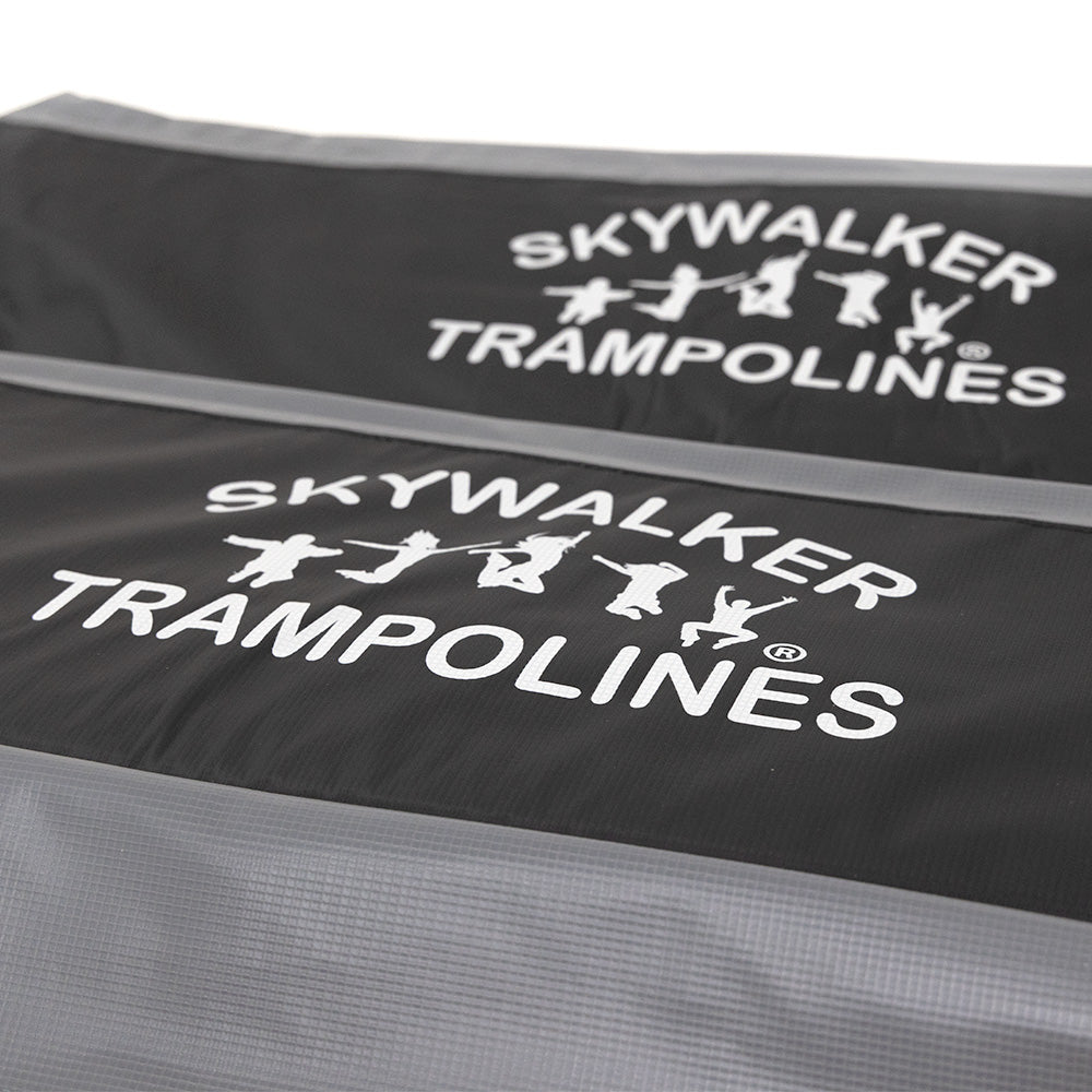 A close-up view of the logo printed onto the black part of the spring pad. 