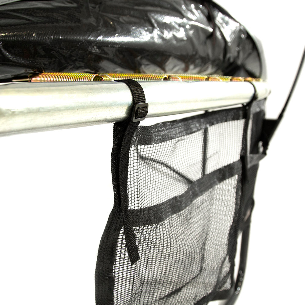 Close-up view of the straps holding the Two Pocket Accessory Storage Bag onto the trampoline.