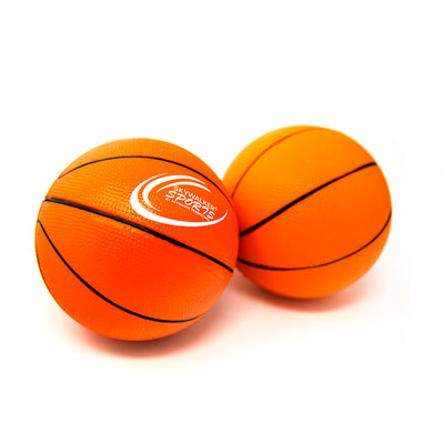 Two orange foam basketballs that have the Skywalker Sports logo on it. 