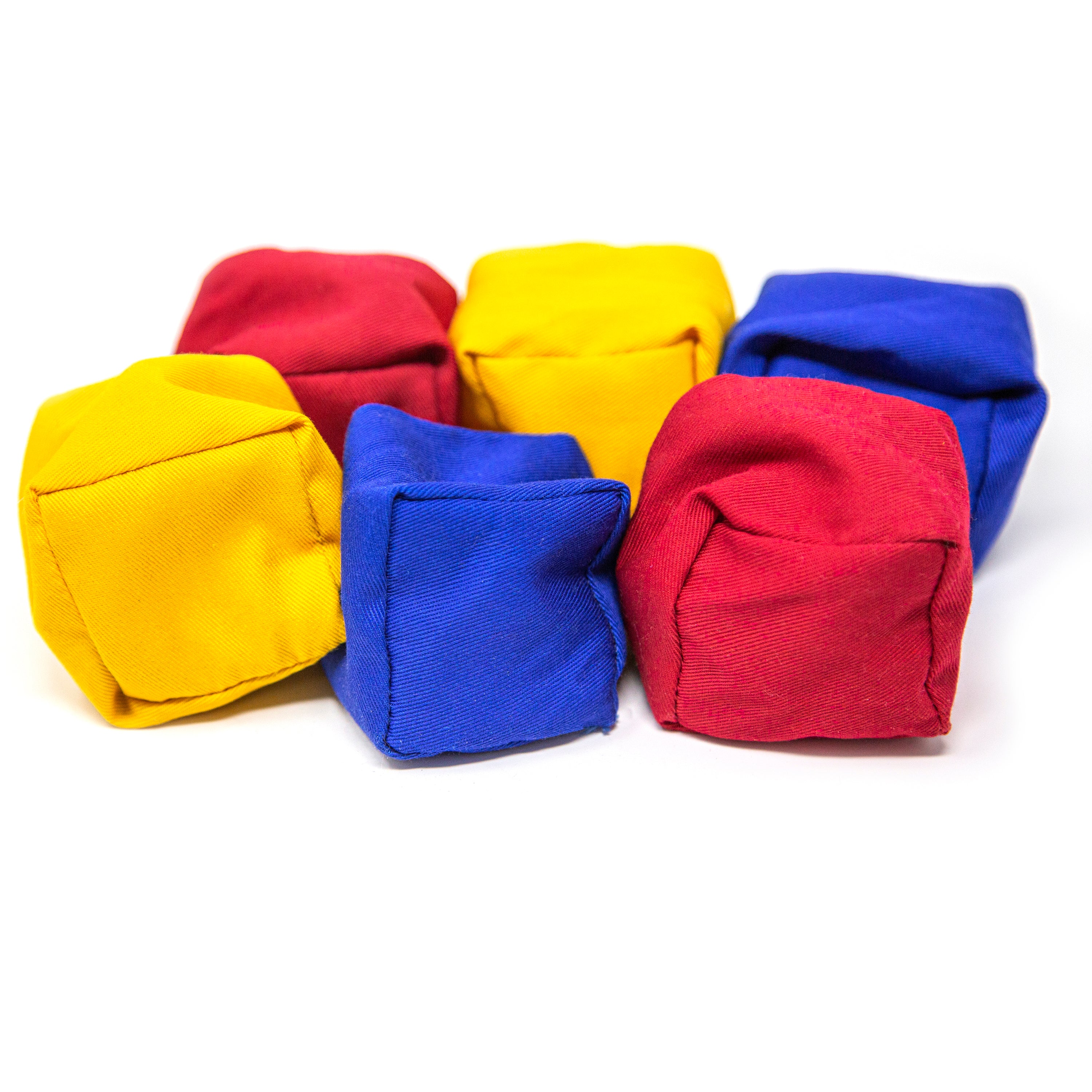 Two yellow, two red, and two blue cloth bean bags. 