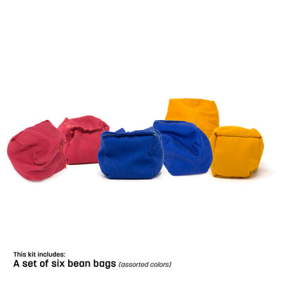 Red, yellow, and blue bean bags sitting next to each other. 