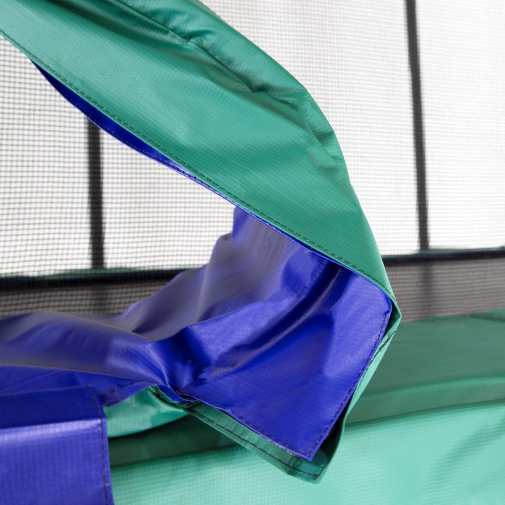 The spring pad is reversible, with blue on one side and green on the other. 