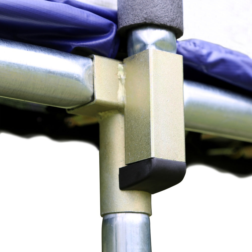 Gold-colored T-socket on trampoline with blue spring pad. 