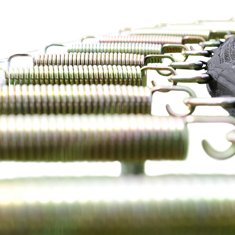 Close-up view of springs attached to a black jump mat. 