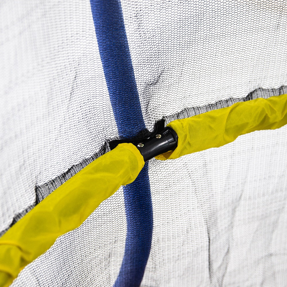 Bright yellow padded handlebar inside the enclosure net. 