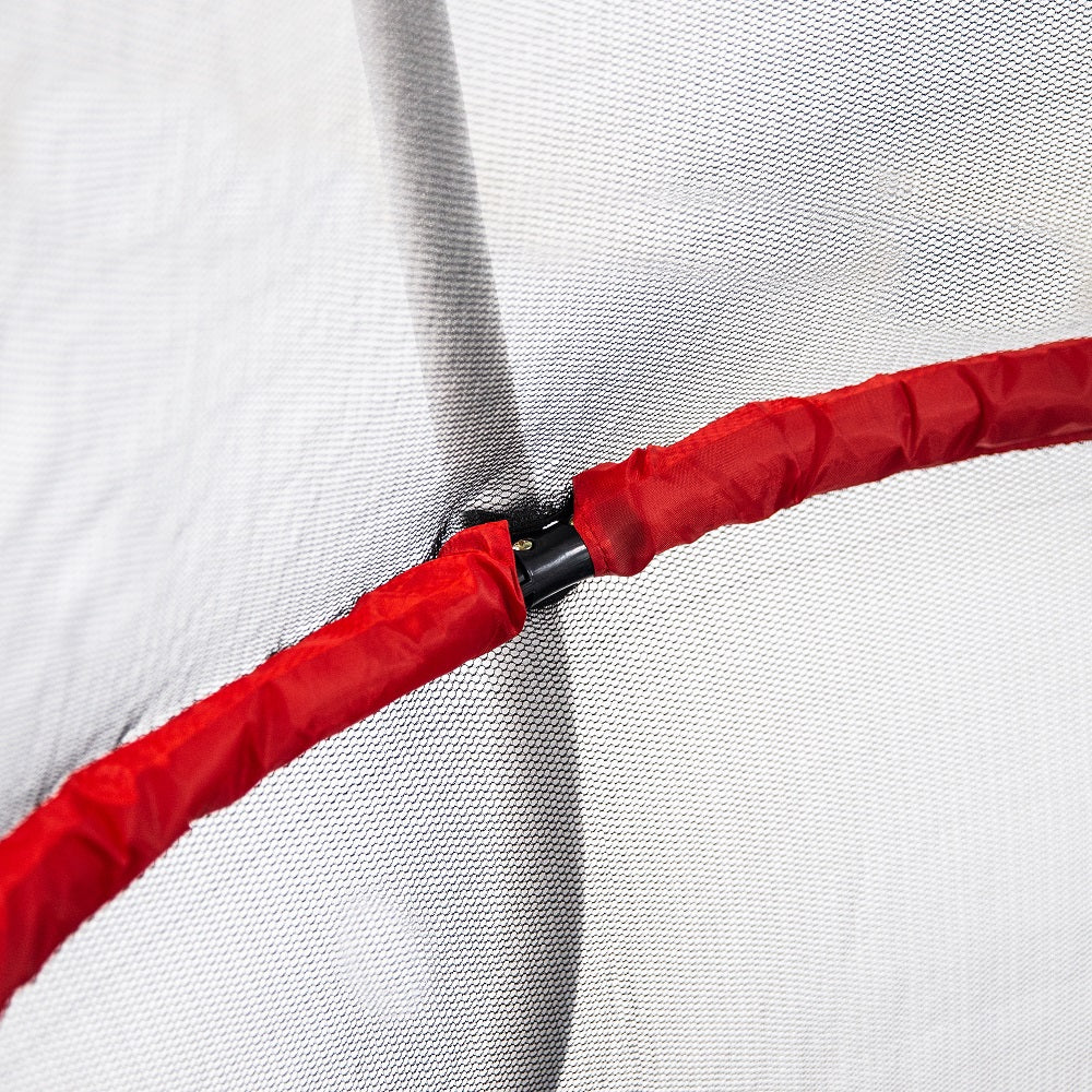 Red padded handlebar on inside of enclosure net, and white enclosure pole outside of the enclosure net. 