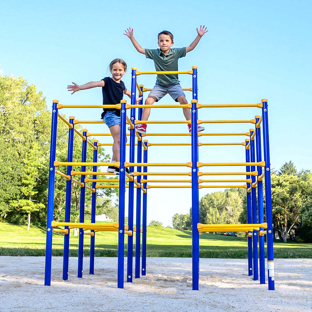 Young boy and girl climb on the yellow and blue modular jungle gym playset base. 