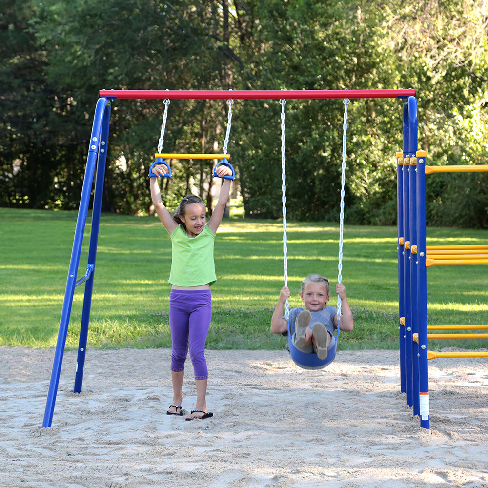 One girl hangs onto the handgrip swing while another girl swings forward on the traditional seat swing. 