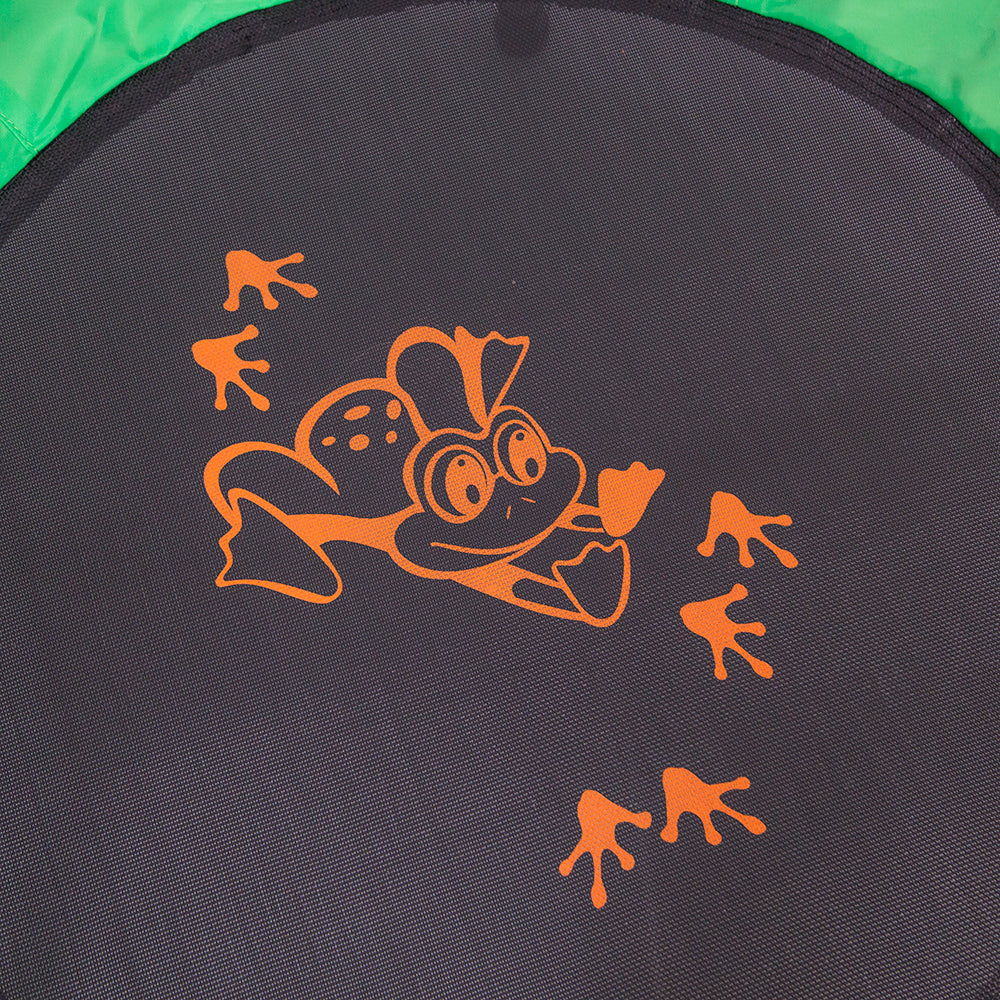 Orange frog design is centered on the black jump mat. 