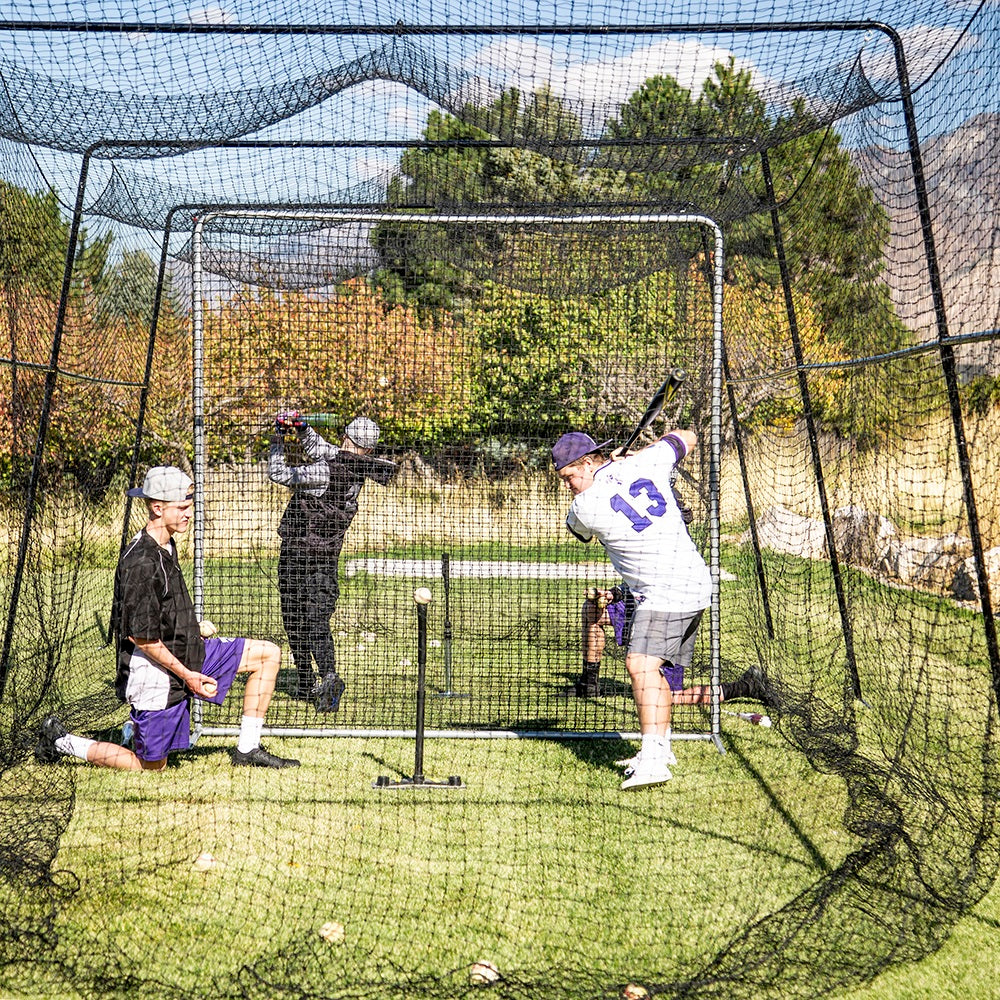 Players use the Fielder Screen for protection in the batting cage. 