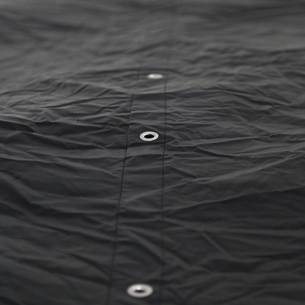 Small holes in trampoline cover allow for built-up water to drain. 