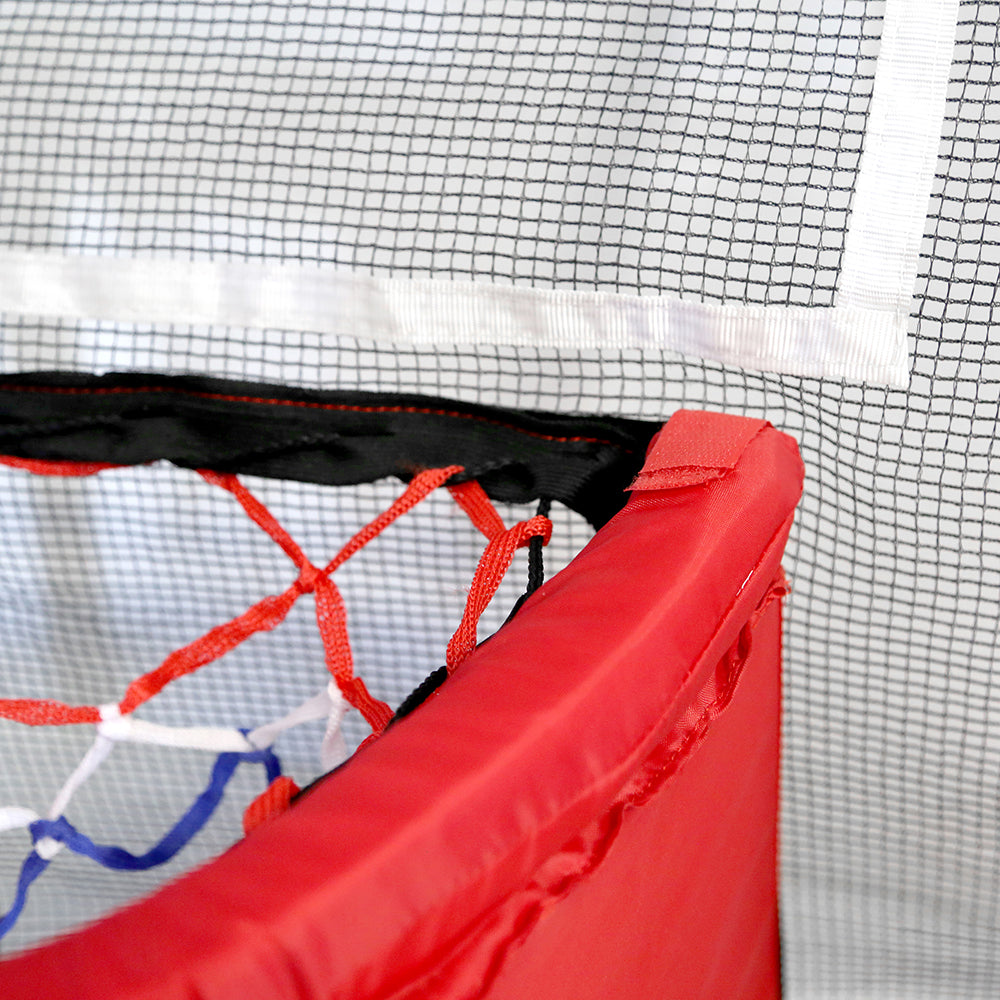 The basketball hoop has a hook-and-loop attachment that breaks away when force is applied to it. 