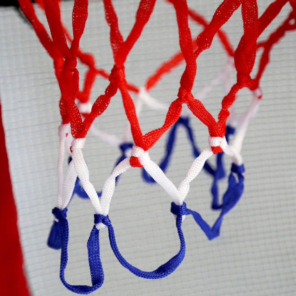 The basketball hoop's netting is red, white, and blue. 