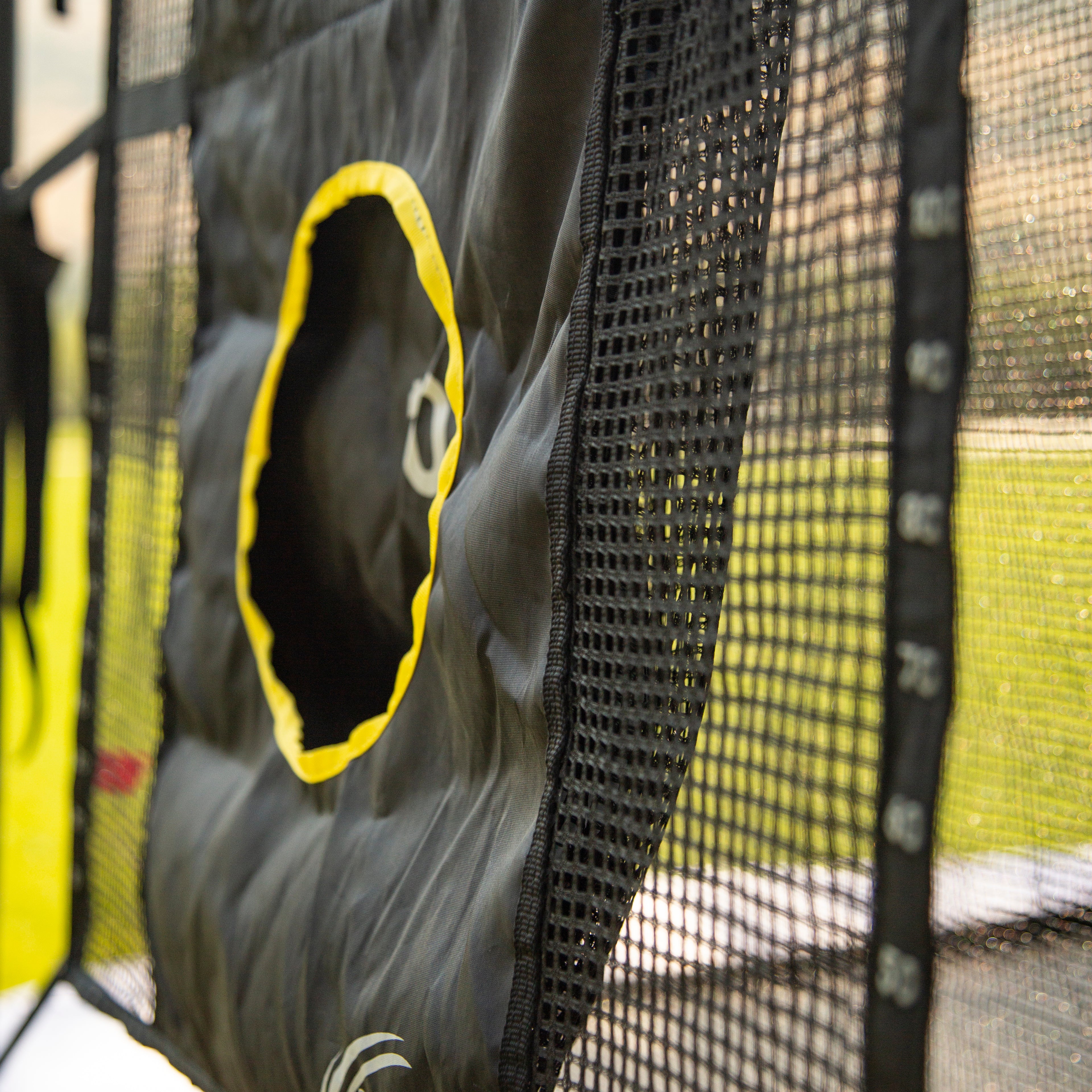 Close-up view of the black netting and the yellow 10 hole on the Triple Toss Game
