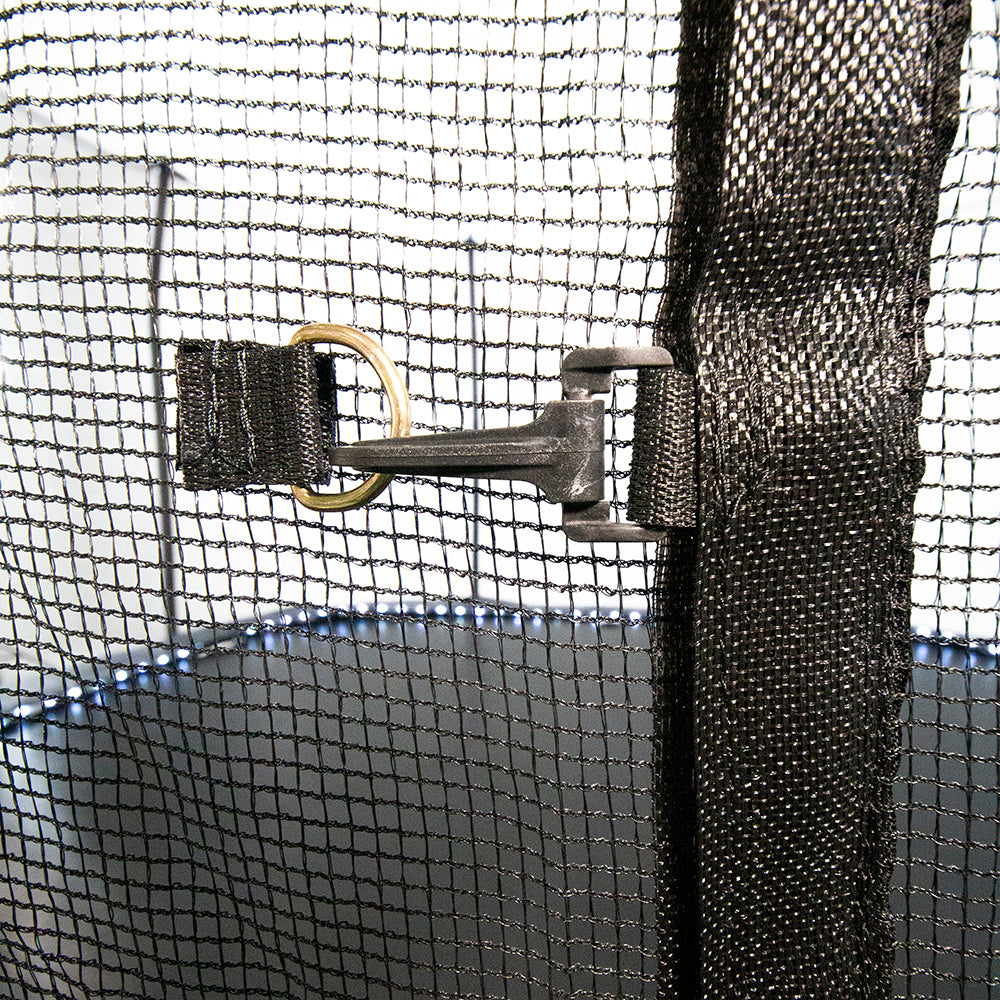 The enclosure net is closed with both a zipper and a clip. The LED lights from the spring pad are shining through the net. 