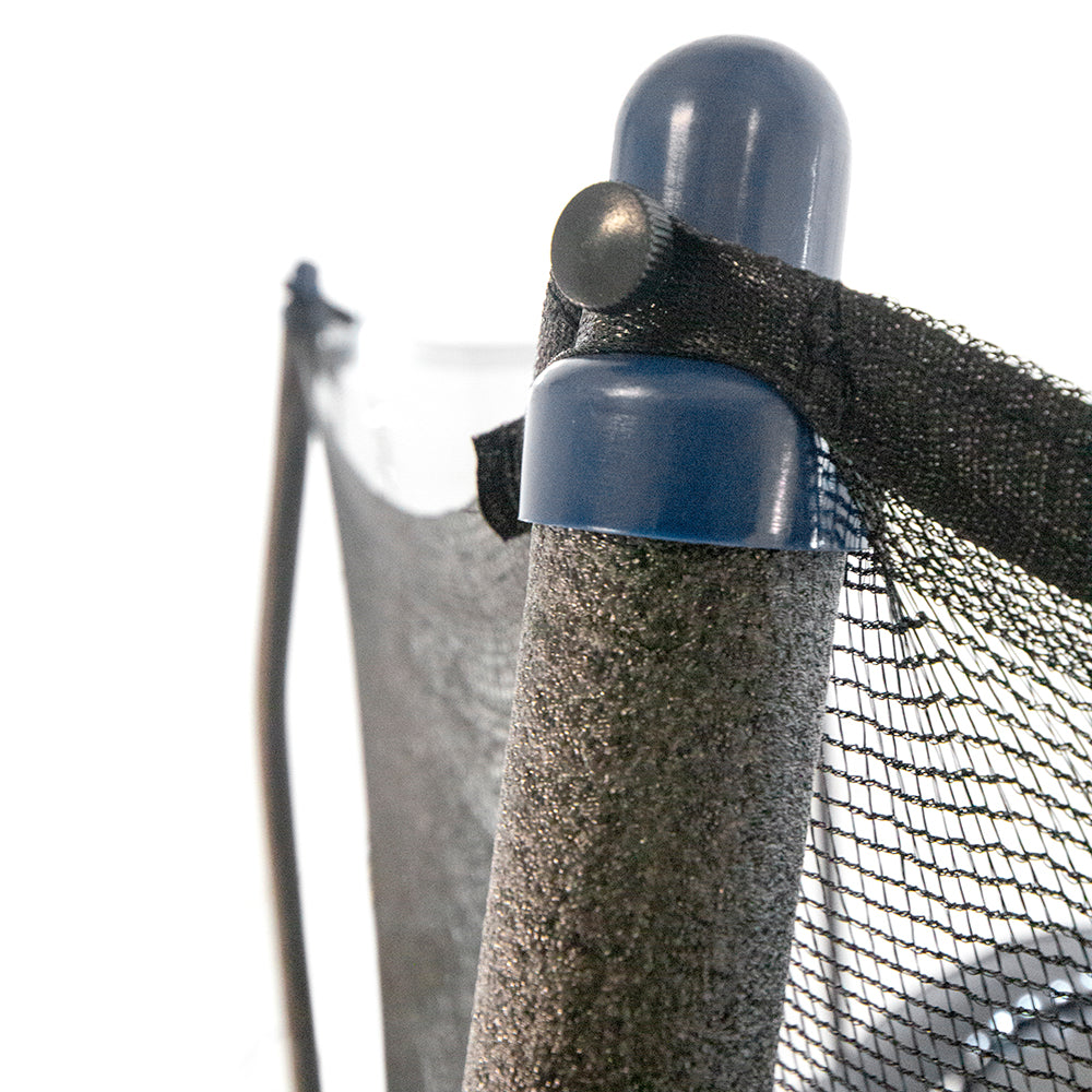The navy pole cap sits on top of the gray foam-covered enclosure pole with the black enclosure net tightly secured around it. 