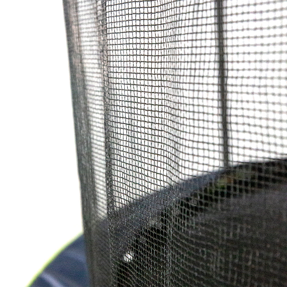 Close-up view of the black, polyethylene enclosure net. The lime green and navy spring pad can be seen below. 