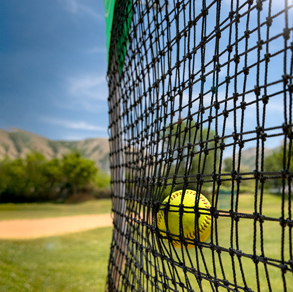 A close-up view of the Sky Screen's netting starting to bulge as a softball hits it. 