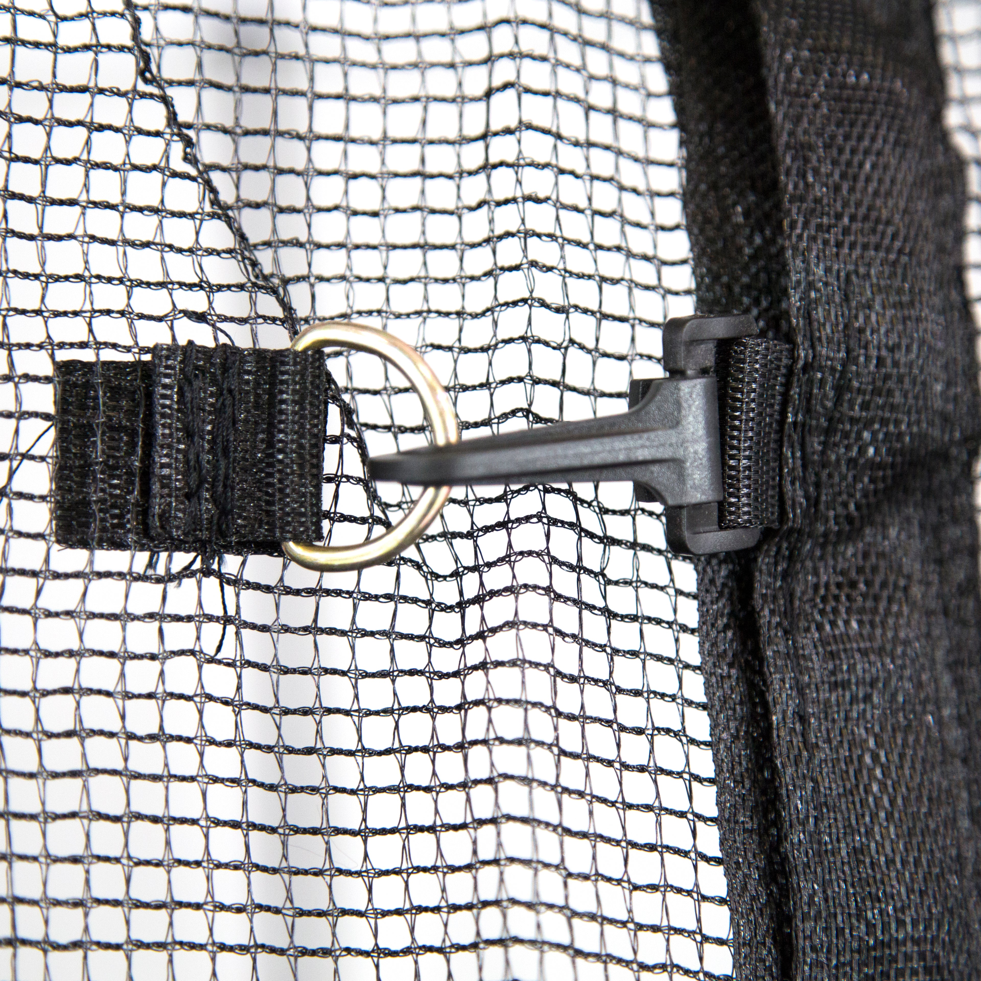 Black clip and zipper both keep the trampoline's enclosure net closed. 