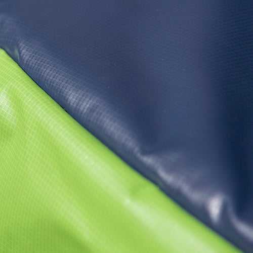 Close-up view of the navy and lime green dual color spring pad.
