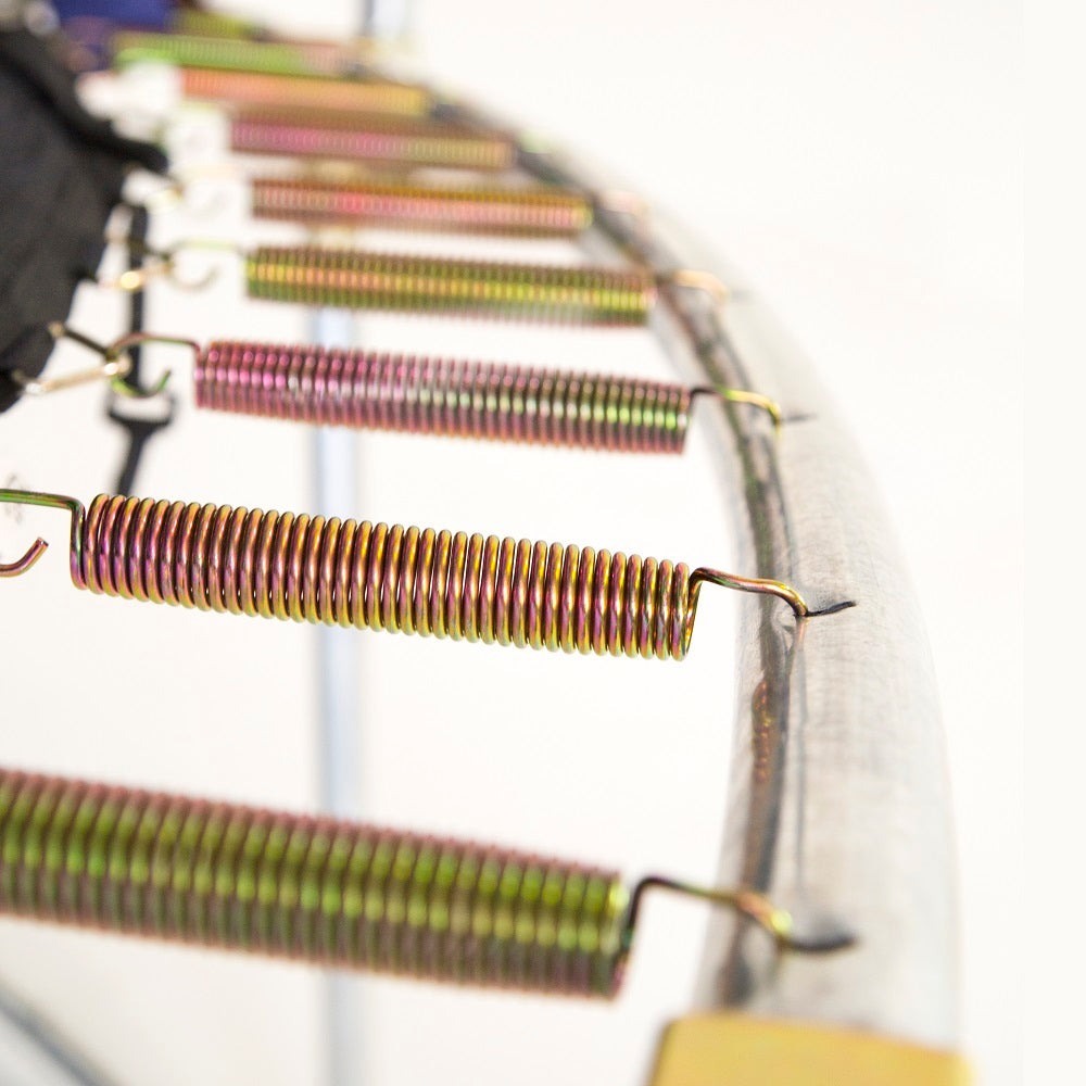 Steel springs are attached to the trampoline frame on one end and attached to the trampoline jump mat on the other end. 